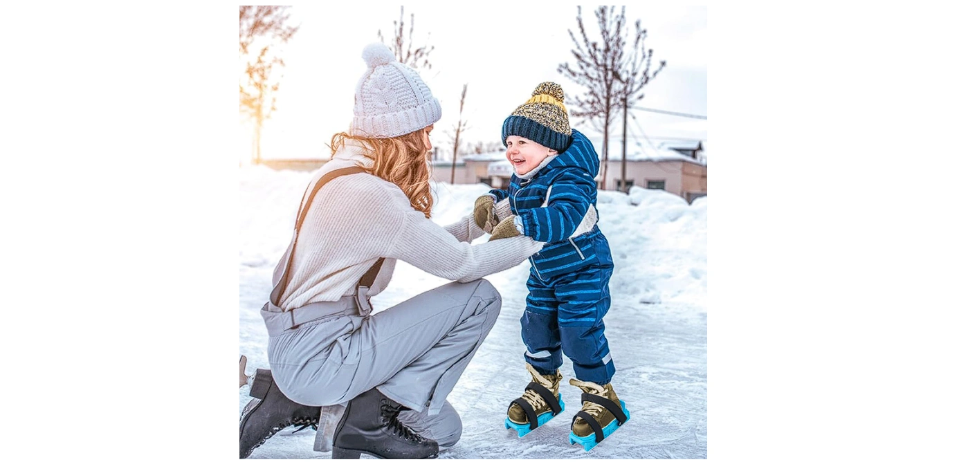toddler skating with his mom
